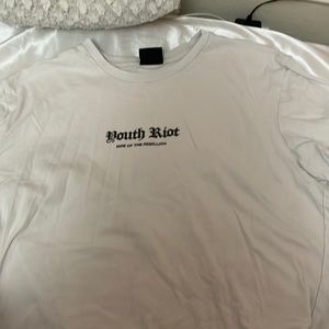 White shirt with words in the middle